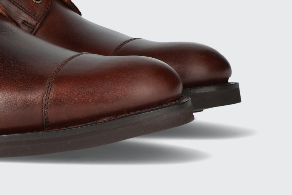 The toes of a pair of oxblood leather boots from the Hartt Shoe company