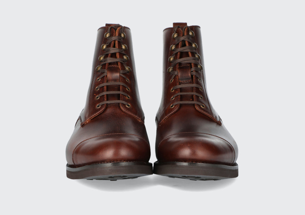 The front of a pair of men's oxblood dress boots from the Hartt Shoe Company
