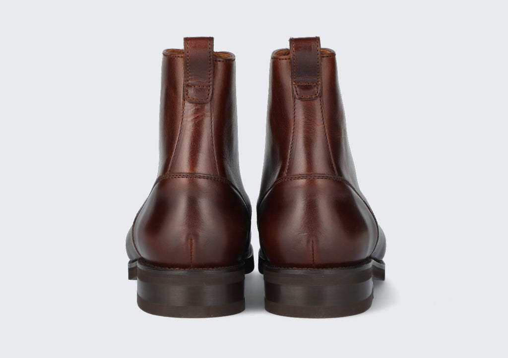 The heels of pair of oxblood dress boots from the Hartt Shoe Company