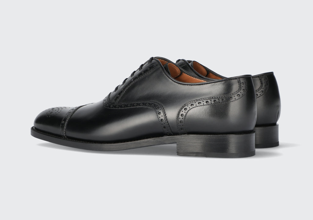A pair of men's black leather shoes from the Hartt Shoe company