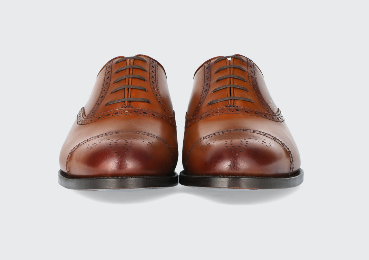The front of a pair of men's brown leather dress shoes from the Hartt Shoe Company