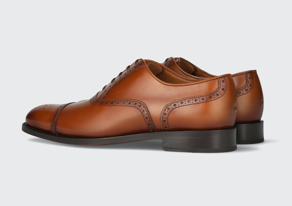 A pair of men's brown leather dress shoes from the Hartt Shoe company