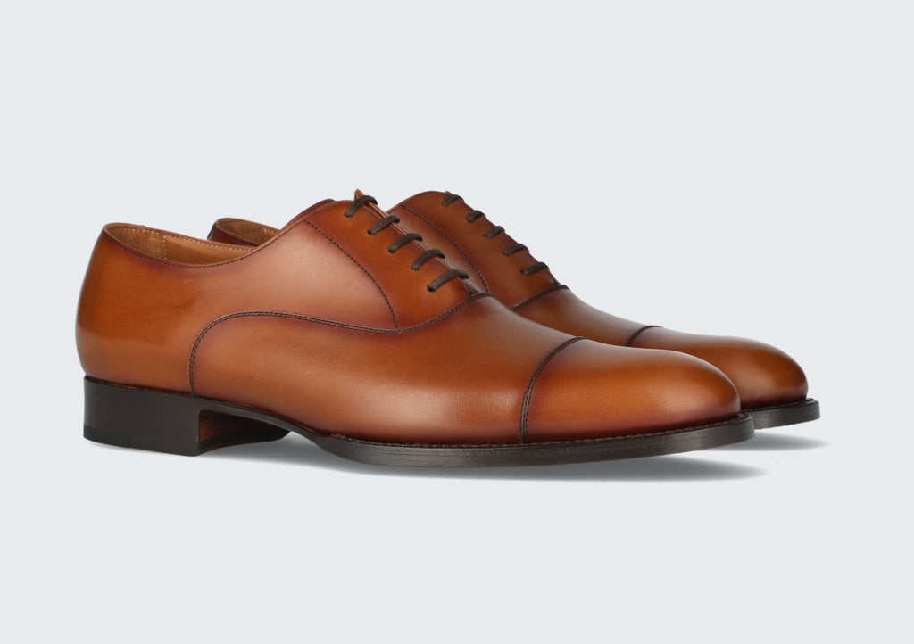 A pair of men's brown leather dress shoes from the Hartt Shoe Company