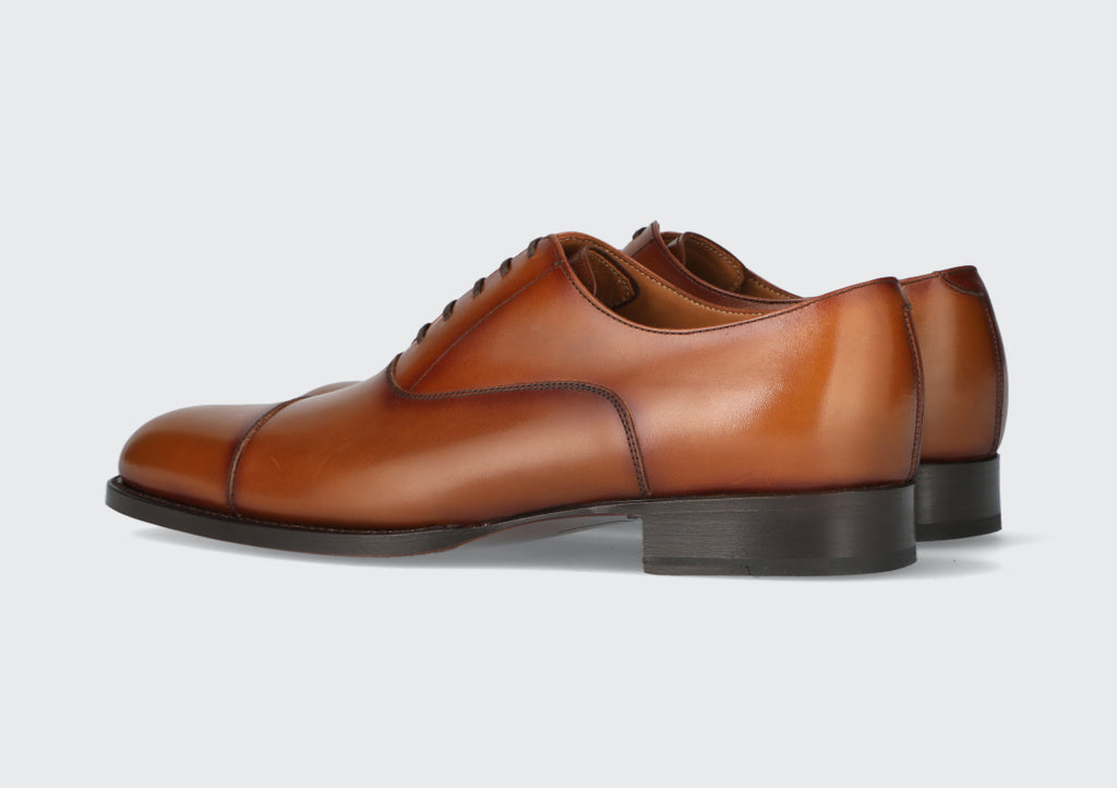 A pair of brown leather oxford dress shoes from the Hartt Shoe Company