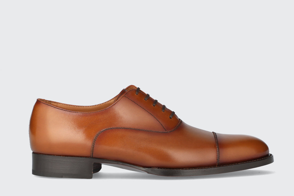 A men's brown leather dress shoe from the Hartt Shoe Company