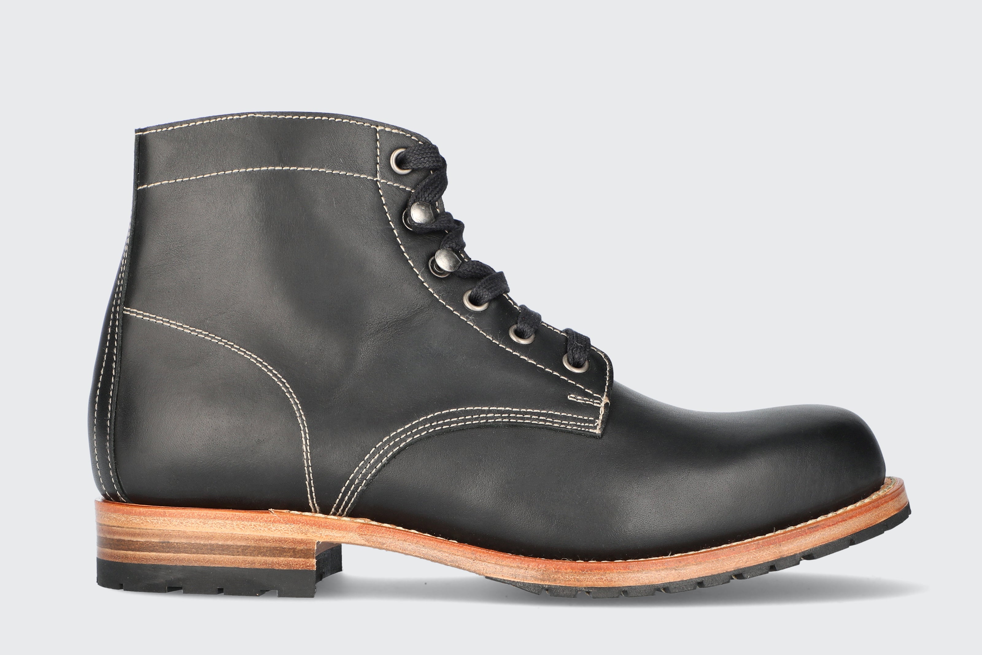 A men's black leather boot made by the Hartt Shoe Company 