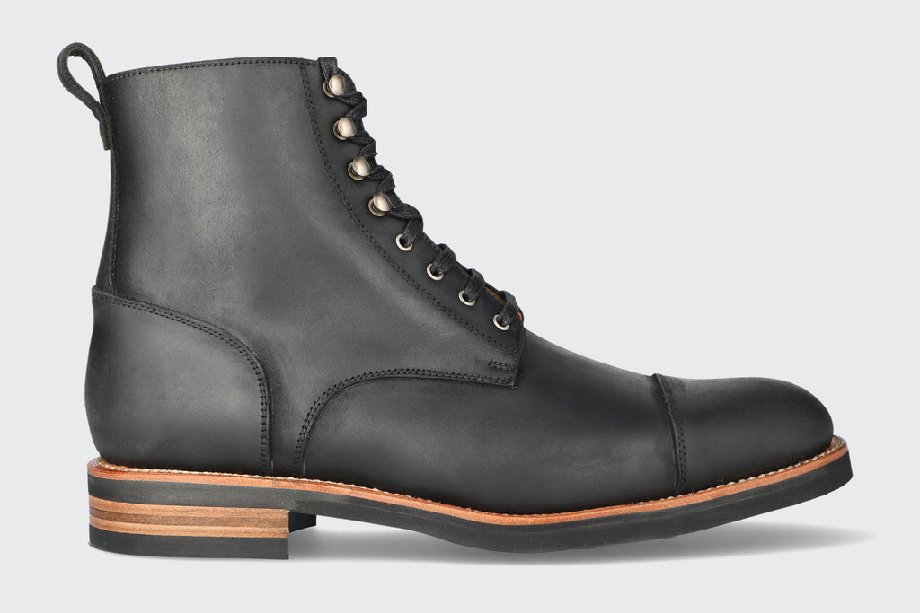A men's black leather brewer boot from the Hartt Shoe company