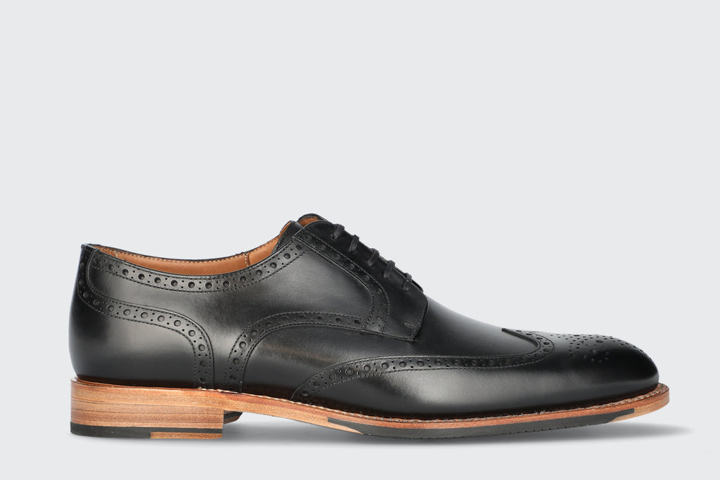 A black leather dress shoe with contrasting sole from the Hartt Shoe Company