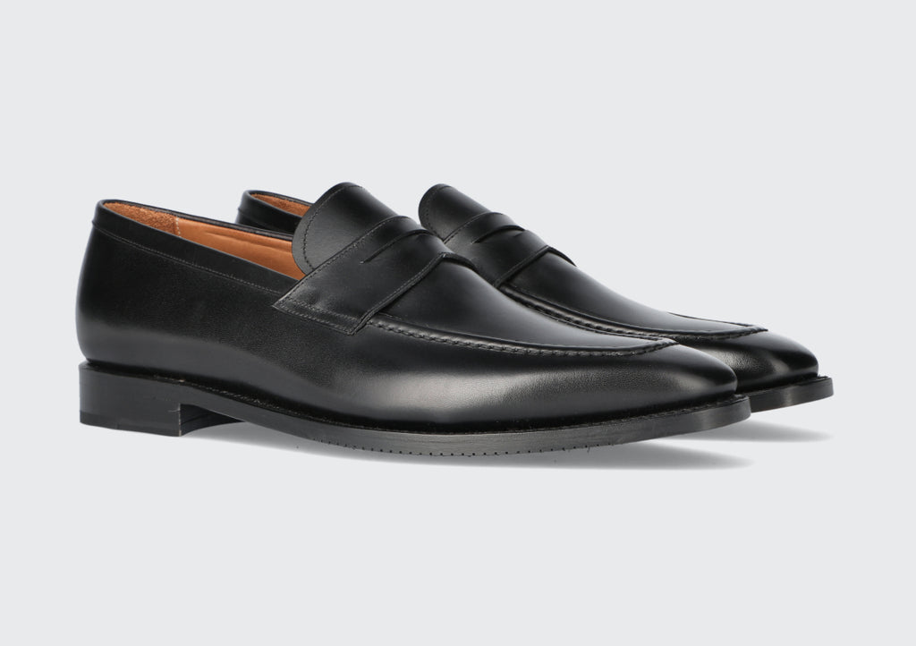 A pair of black leather loafers from the Hartt Shoe company