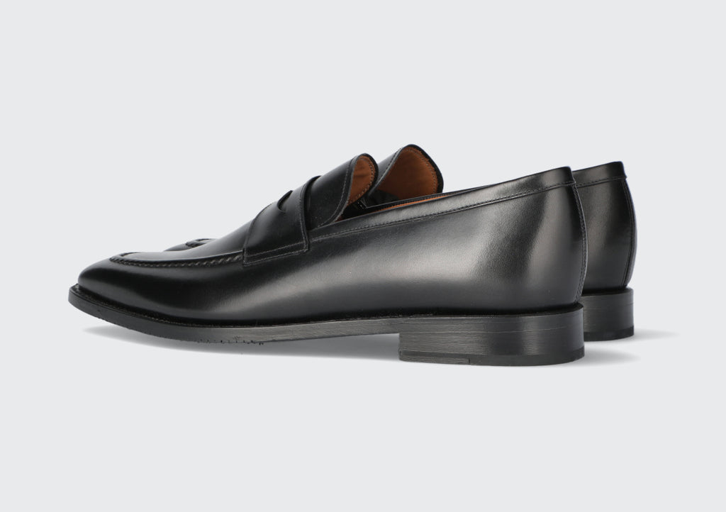 A pair of men's black loafers from the Hartt Shoe company