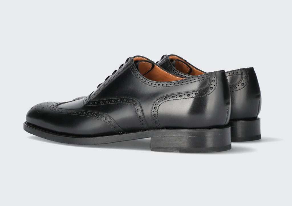 A pair of black leather dress shoes from the Hartt Shoe Company