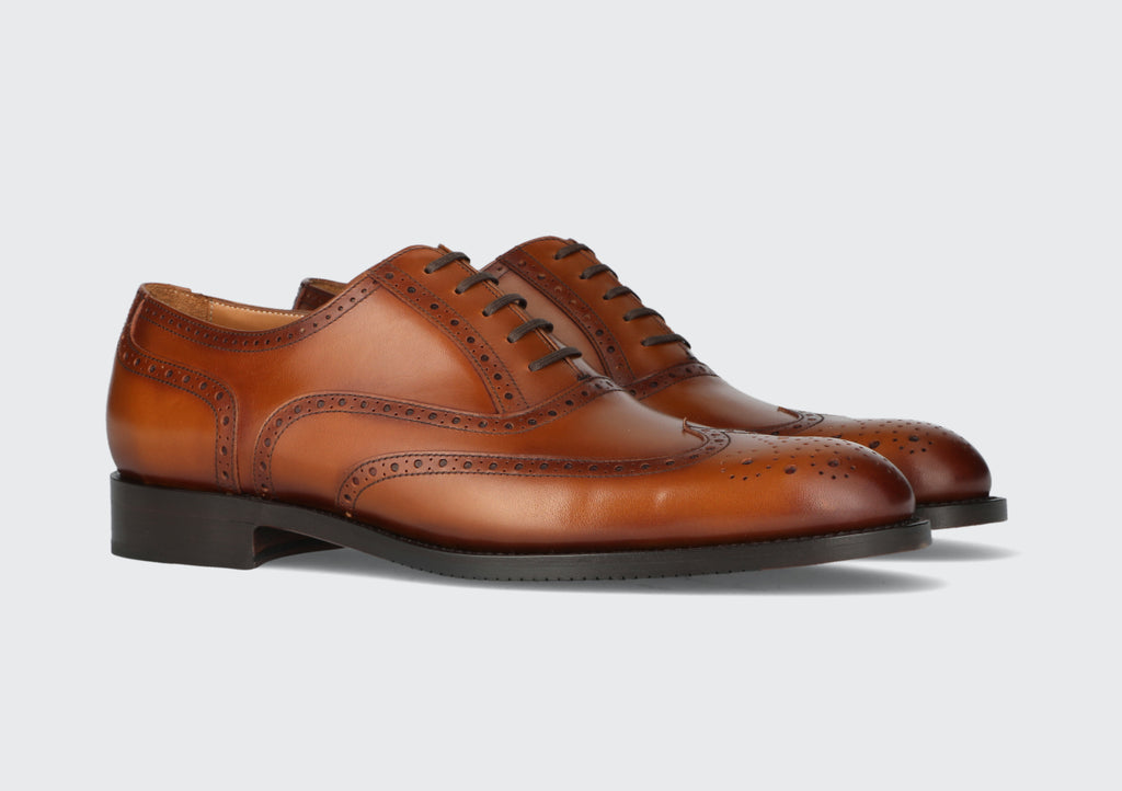 A pair of brown leather men's dress shoes from the Hartt Shoe Company